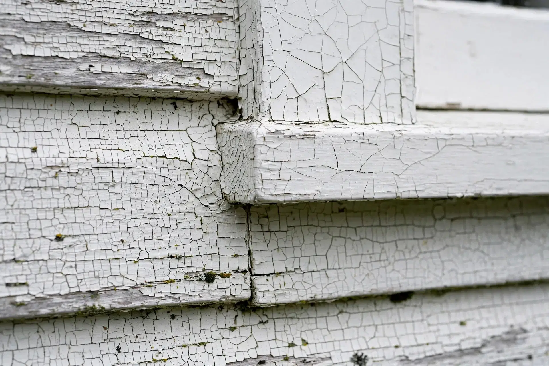5 Signs Your House Exterior Needs Repainting in NZ 3 Hairline cracks in exterior paint around window frame NZ