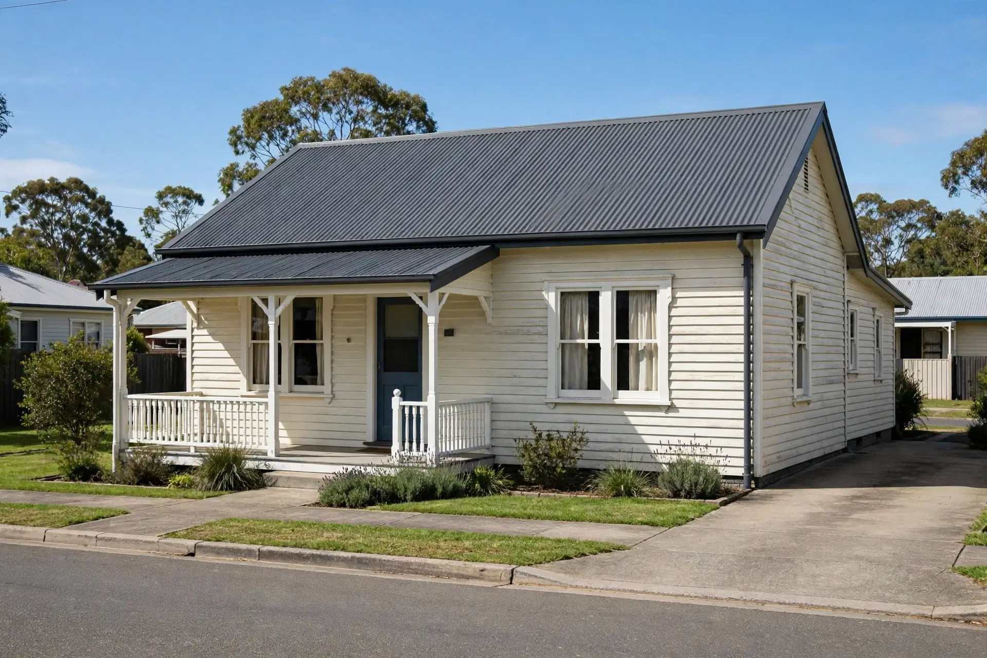 House Painters in Waitangirua: Best Local Painting Contractors 8 A 1960s weatherboard home in Waitangirua with a freshly painted dark grey corrugated iron roof